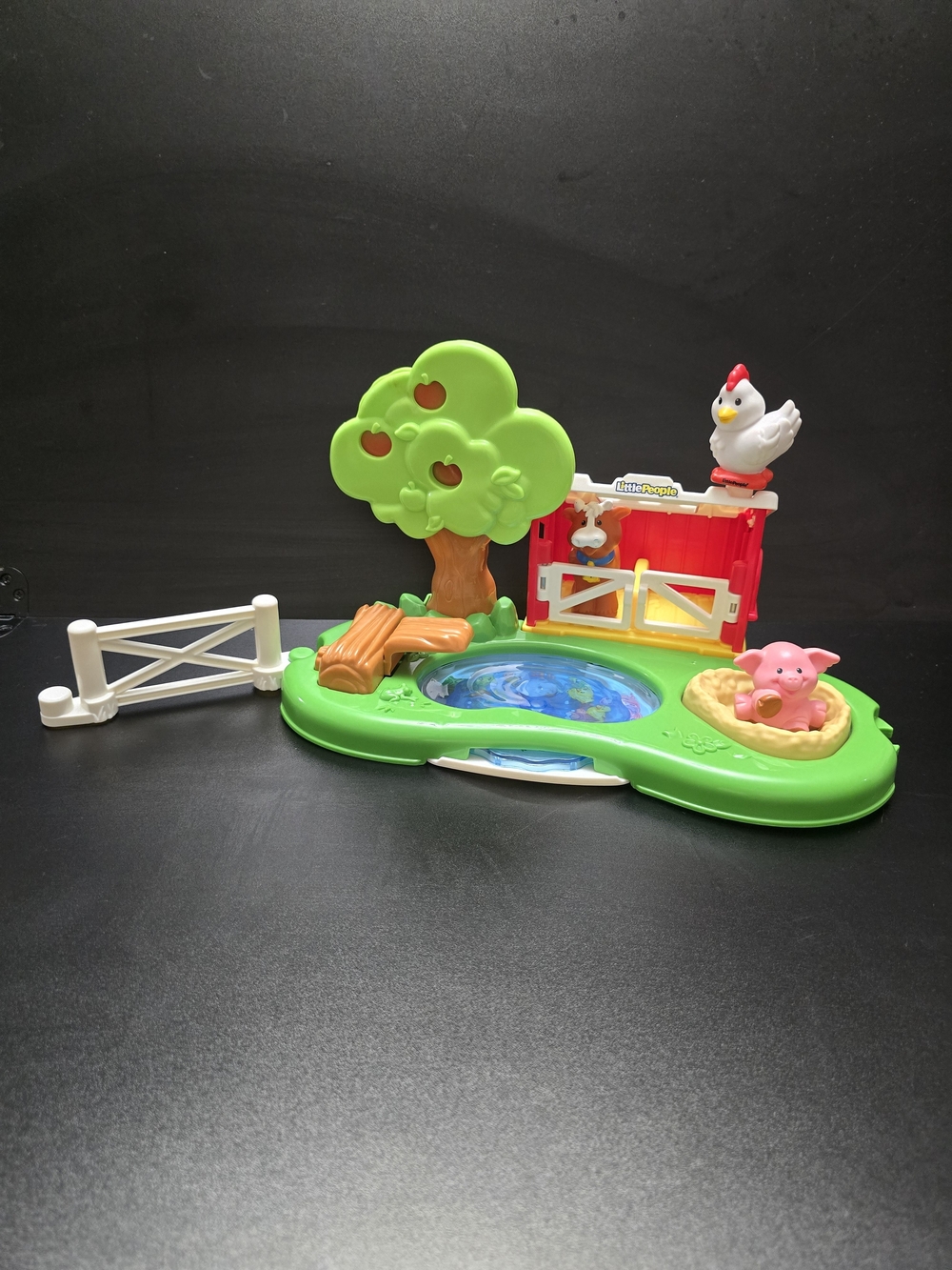 Mattel Green Farm Playset with Red Barn, White Fence, and Pink Pig Figure
